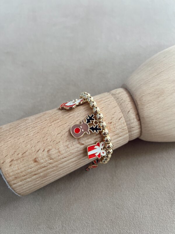 Pulsera balines dorados navideña